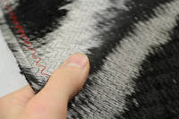 300gsm Biaxial Carbon Fibre Reinforcement, Reverse Side - In Hand Closeup Thumbnail
